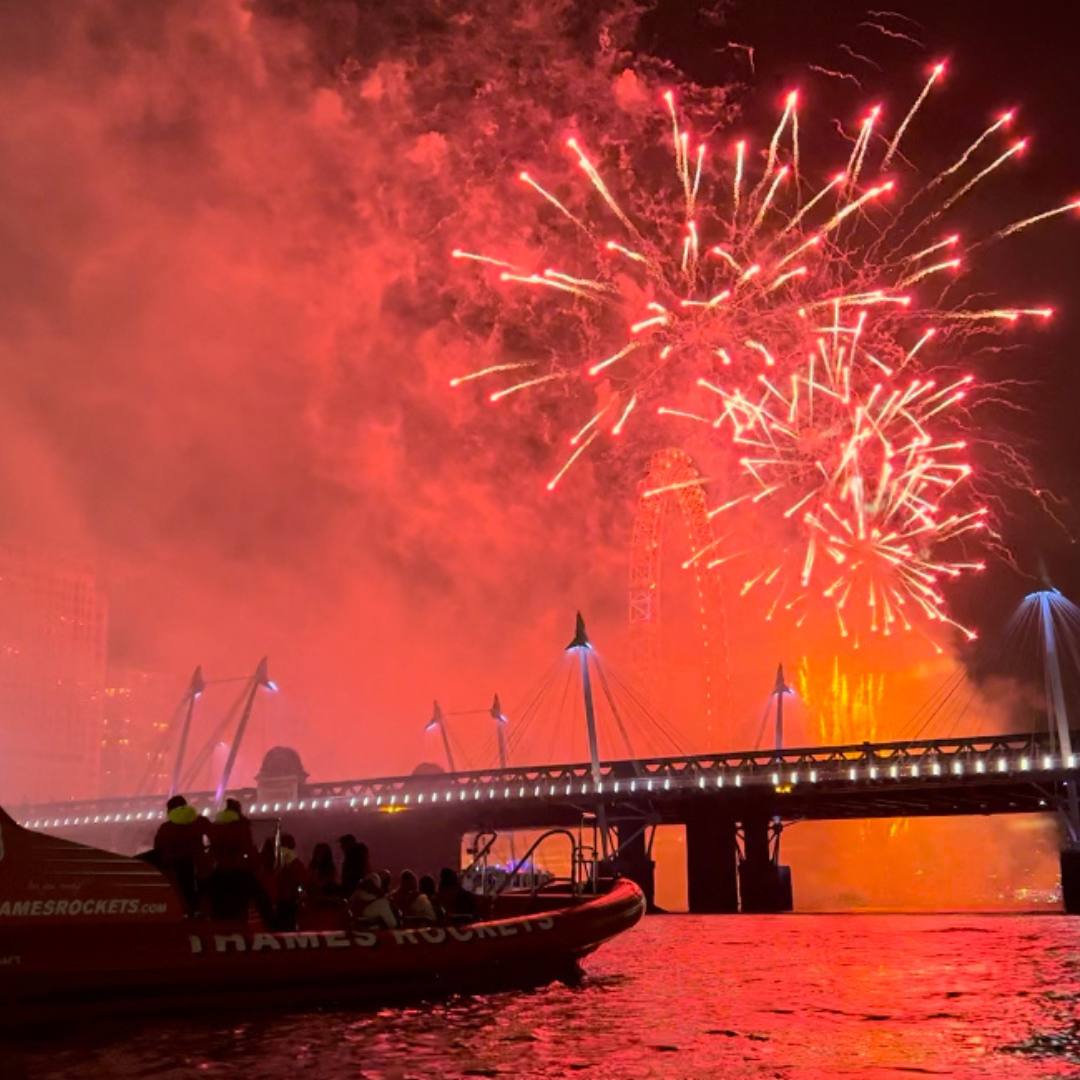 new years eve spectacular firework display on river thames with thames rockets
